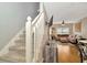 View of carpeted staircase leading to the second floor and a glimpse of the living room at 267 Countryside Key Blvd, Oldsmar, FL 34677