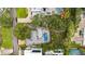A bird's eye view of the property featuring a private pool and lush landscaping at 3108 S Omar Ave, Tampa, FL 33629