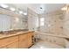 Bathroom with dual sinks and tile, awaiting renovation and personalization to create your dream space at 3108 S Omar Ave, Tampa, FL 33629
