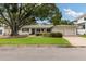 Inviting single-story home with a manicured lawn and convenient two-car garage at 3108 S Omar Ave, Tampa, FL 33629