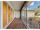 Cozy front porch featuring decorative metal railings and patterned floor tiles at 3108 S Omar Ave, Tampa, FL 33629