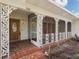 Welcoming covered porch area with decorative columns and patterned tile at 3108 S Omar Ave, Tampa, FL 33629