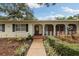 Charming single-story home with well-maintained landscaping and inviting front porch at 3108 S Omar Ave, Tampa, FL 33629