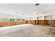 Open-concept living area with large windows, awaiting renovation and personalization to create your dream space at 3108 S Omar Ave, Tampa, FL 33629