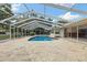 Inviting screened-in pool area featuring a large deck, perfect for outdoor relaxation and entertainment at 3108 S Omar Ave, Tampa, FL 33629