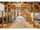 Spacious unfinished attic featuring wood beams and a window for natural light at 3269 Nicks Pl, Clearwater, FL 33761