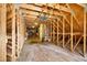 Unfinished attic featuring wooden beams and ample space for storage or future expansion at 3269 Nicks Pl, Clearwater, FL 33761
