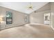 Spacious bedroom featuring a ceiling fan, neutral paint, and bright, natural light at 3269 Nicks Pl, Clearwater, FL 33761