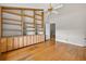 Bedroom features a large built-in wooden bookshelf and bamboo flooring at 3269 Nicks Pl, Clearwater, FL 33761