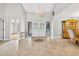 Elegant foyer featuring tile floors, high ceilings, and a chandelier, leading into a dining area at 3269 Nicks Pl, Clearwater, FL 33761