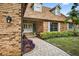 Charming home featuring a paved pathway, manicured landscaping, and a classic double-door entrance at 3269 Nicks Pl, Clearwater, FL 33761