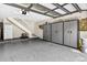 Spacious garage features storage cabinets and access to the home's upper level at 3269 Nicks Pl, Clearwater, FL 33761