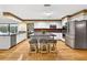 Bright kitchen features an island, stainless steel appliances, and stylish decor at 3269 Nicks Pl, Clearwater, FL 33761