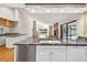 Bright kitchen with modern appliances, and a view into the living area at 3269 Nicks Pl, Clearwater, FL 33761