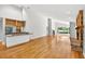 Spacious living room featuring brick fireplace and view to a large window and bar area at 3269 Nicks Pl, Clearwater, FL 33761