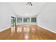 Spacious living room with bamboo floors, ceiling fan, and large bay window at 3269 Nicks Pl, Clearwater, FL 33761