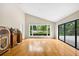 Bright living room with hardwood floors and vintage jukebox at 3269 Nicks Pl, Clearwater, FL 33761