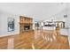Open-concept living room with brick fireplace and hardwood floors at 3269 Nicks Pl, Clearwater, FL 33761