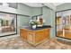 Outdoor kitchen area with counter space, a sink and grill, offering a seamless entertaining experience at 3269 Nicks Pl, Clearwater, FL 33761