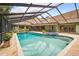 Stunning pool and spa surrounded by lush landscaping, and screened in for privacy and enjoyment at 3269 Nicks Pl, Clearwater, FL 33761