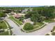Aerial view showcasing the property's well-manicured lawn, mature trees, and proximity to the surrounding neighborhood at 3501 Sarazen Dr, New Port Richey, FL 34655