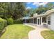Well-maintained backyard featuring a stone walkway and beautiful landscaping at 3501 Sarazen Dr, New Port Richey, FL 34655