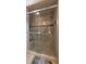 Bathroom featuring tiled shower with glass enclosure and built-in seat at 3501 Sarazen Dr, New Port Richey, FL 34655