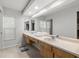 Bright bathroom featuring a double sink vanity and large mirror at 3501 Sarazen Dr, New Port Richey, FL 34655