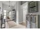 Welcoming foyer with stylish flooring, decorative cabinet, and a view of the front entrance at 3501 Sarazen Dr, New Port Richey, FL 34655