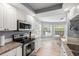 Eat-in kitchen area is bright with stainless appliances and lots of light at 3501 Sarazen Dr, New Port Richey, FL 34655