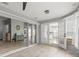 View of sunroom with sliding glass doors to an outdoor area at 3501 Sarazen Dr, New Port Richey, FL 34655