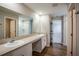Bathroom featuring double sinks, a shower and an adjacent closet at 36933 Sagemoor Dr, Zephyrhills, FL 33541