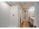 Bathroom with a shower and vanity with an open doorway to the walk-in closet at 36933 Sagemoor Dr, Zephyrhills, FL 33541