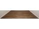 Durable and attractive wood laminate flooring in a hallway or living space at 36933 Sagemoor Dr, Zephyrhills, FL 33541