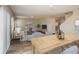 Inviting living area with comfortable seating, wood-look floors, and lots of natural light at 36933 Sagemoor Dr, Zephyrhills, FL 33541