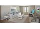 Bright living room features a comfortable sofa, neutral decor, and an artist's workstation at 36933 Sagemoor Dr, Zephyrhills, FL 33541