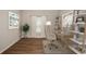 Bright home office featuring a stylish desk, neutral tones, and wood-look floors at 36933 Sagemoor Dr, Zephyrhills, FL 33541