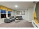 A comfortable living room with stylish decor, modern furniture, and unique art pieces for a relaxing ambiance at 37092 Sagemoor Dr, Zephyrhills, FL 33541