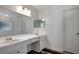 Bright bathroom featuring a double sink vanity with modern finishes and sleek fixtures at 4129 Marlow Loop, Land O Lakes, FL 34639