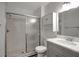 A modern bathroom featuring tile floors, a glass shower, and a gray vanity at 4129 Marlow Loop, Land O Lakes, FL 34639