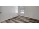 Bedroom featuring modern flooring, a window, and neutral walls at 4129 Marlow Loop, Land O Lakes, FL 34639