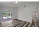 Bedroom with new flooring and sliding glass doors to a private pool at 4129 Marlow Loop, Land O Lakes, FL 34639