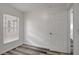 Bedroom featuring modern flooring, a window, and neutral walls at 4129 Marlow Loop, Land O Lakes, FL 34639