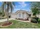 Charming single-story home featuring well-manicured landscaping and a two-car garage at 4129 Marlow Loop, Land O Lakes, FL 34639