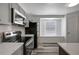 Modern kitchen features gray cabinets, subway tile backsplash, and stainless steel appliances at 4129 Marlow Loop, Land O Lakes, FL 34639