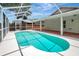 Relax in this screened-in pool with ample room for outdoor activities and entertaining at 4129 Marlow Loop, Land O Lakes, FL 34639