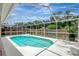 An inviting screened-in pool offers a refreshing oasis with clear water and a spacious deck at 4129 Marlow Loop, Land O Lakes, FL 34639