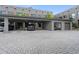 Modern complex with covered parking, private garages, and brick-paved parking spaces at 4148 Gauge Line Loop, Tampa, FL 33624