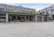 Modern complex with covered parking, garages, and ample brick-paved parking spots at 4148 Gauge Line Loop, Tampa, FL 33624