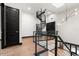 Hallway with a spiral staircase, modern railing, wood floors, and doors at 4148 Gauge Line Loop, Tampa, FL 33624